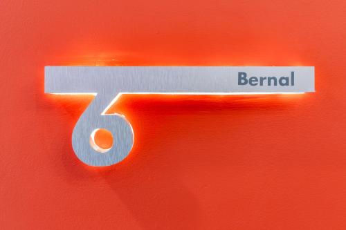a sign with the number five on a red background at Casa Castillo in Mexico City