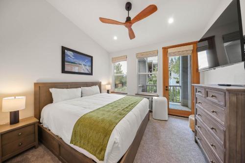 a bedroom with a bed and a ceiling fan at Palisades Tahoe Lodge Rentals Premium Two Bedroom #805 in Olympic Valley