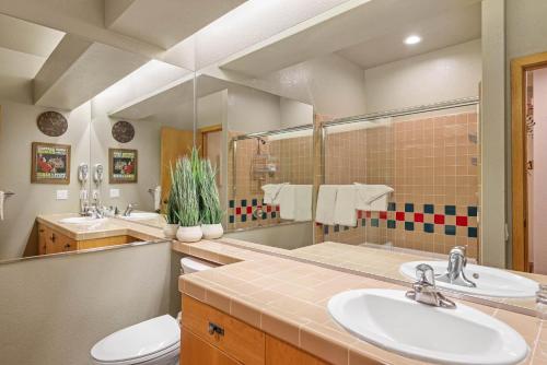 a bathroom with two sinks and a toilet at Studio #151 in Olympic Valley
