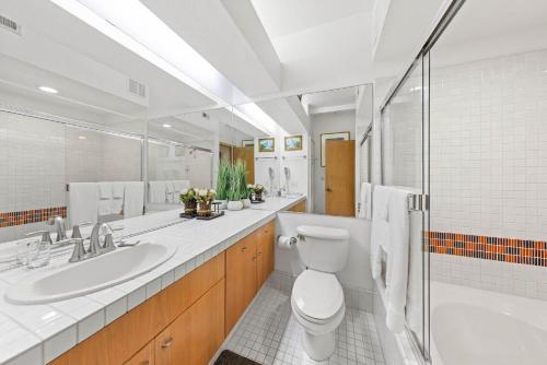 a bathroom with a toilet and a sink at Palisades Tahoe Lodge Rentals Studio #214 in Olympic Valley