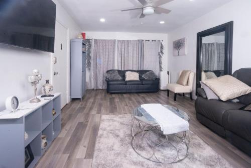 a living room with a couch and a table at Blanquitas Home in Long Beach
