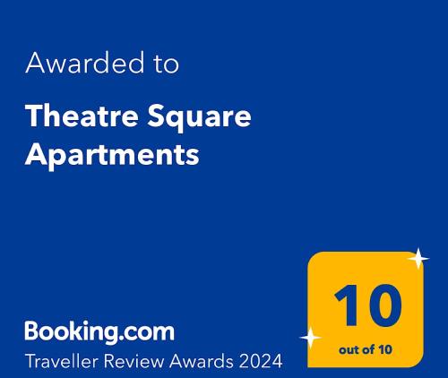 a yellow sign with the text awarded to theatre square apartments at Theatre Square Apartments in Novi Sad