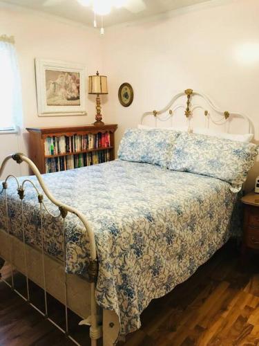 a bedroom with a bed and a book shelf at Robin's Roost in Sevierville