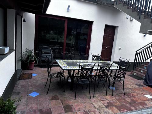a table and chairs sitting on a patio at Sciara Casa Vacanze in Pedara