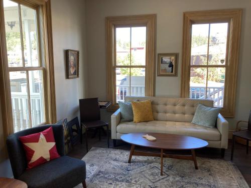 a living room with a couch and a table at Tahoe Star Hotel in Truckee
