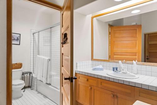 a bathroom with a sink and a toilet and a mirror at Standard Room #816(B SIDE) in Olympic Valley