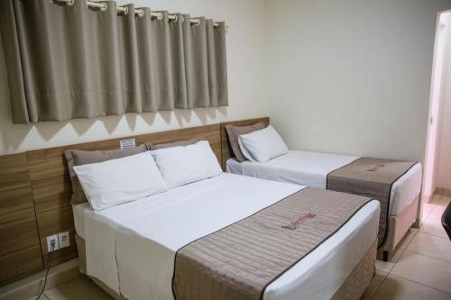 Ένα ή περισσότερα κρεβάτια σε δωμάτιο στο Revitalle Hotel