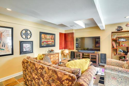 a living room with a couch and a table at Charming Savage Home with Yard 18 Mi to Minneapolis in Savage