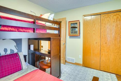 a bedroom with two bunk beds and a desk at Charming Savage Home with Yard 18 Mi to Minneapolis in Savage