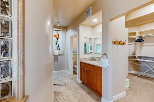 a bathroom with a sink and a mirror at Bay Park Villa in San Diego