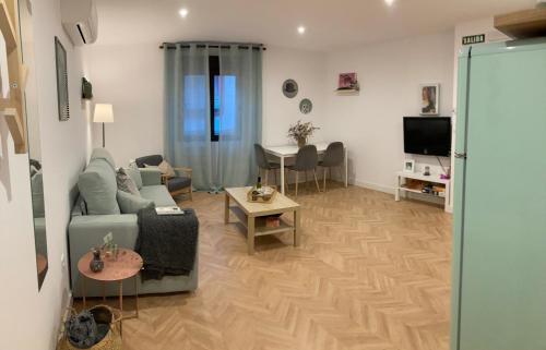Μια τηλεόραση ή/και κέντρο ψυχαγωγίας στο Apartamentos Abadía.