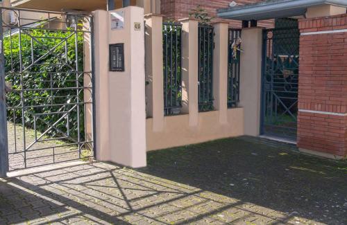 an entrance to a building with an iron gate at Domus Vivendi Pompeii holiday home free parking in Pompei