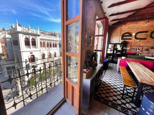 a balcony with a view of a building at ECO Hostel in Granada