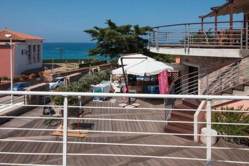 a group of stairs with a view of the ocean at Holiday home Isola Rossa in Isola Rossa