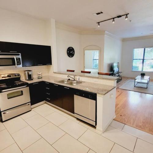 a kitchen with a sink and a stove top oven at Fantastic 1-Bedroom Close to Reliant Stadium & Medical Center in Houston