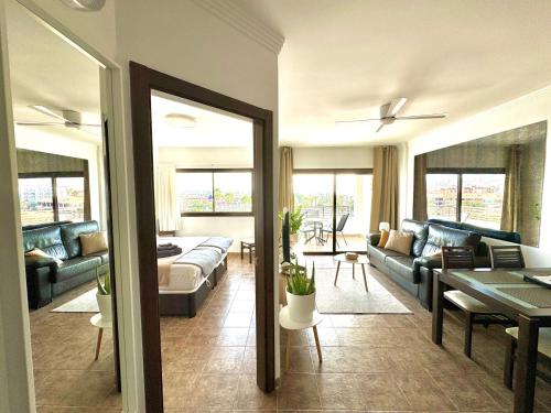 a living room with a couch and a table at Iguazu I Yumbo Third Floor Apartment in Playa del Ingles