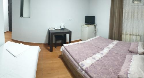 Postel nebo postele na pokoji v ubytování Hotel Amigo