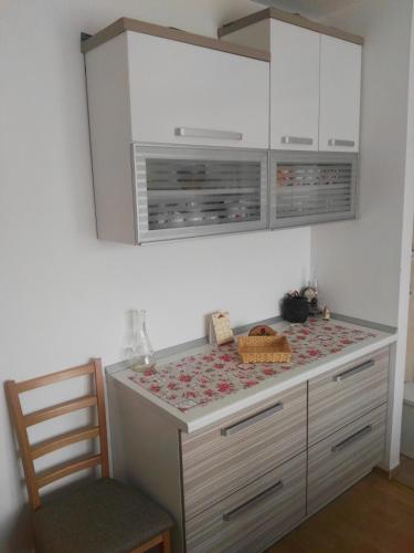 a kitchen with a island with a counter top at Apartmani Janjic in Banja Luka