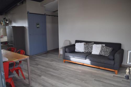 a living room with a couch and a table at Clayhouse Rivadavia in Rivadavia