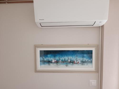a picture of a painting on a wall at Apartmani Janjic in Banja Luka