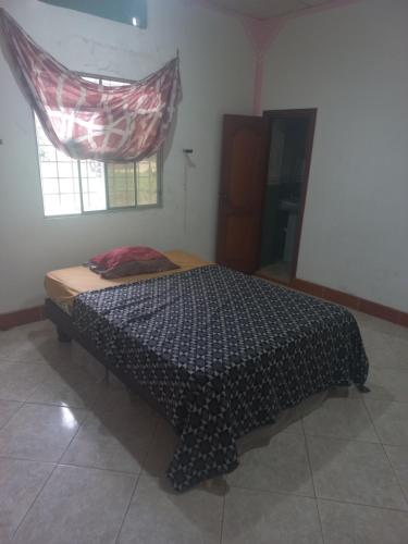Un pat sau paturi într-o cameră la La Pollera