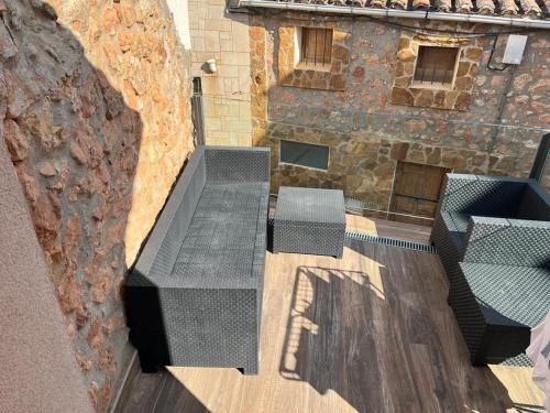 an overhead view of a bench in front of a building at Suite a las orillas del Duero 