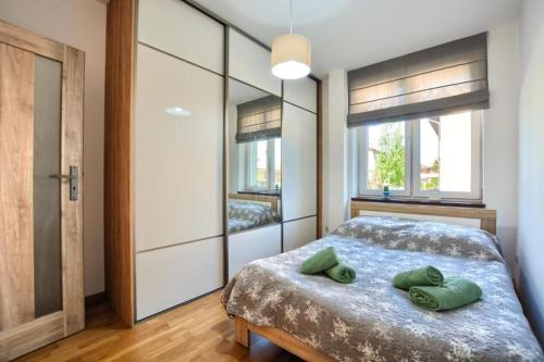 Posteľ alebo postele v izbe v ubytovaní Apartament Michalina