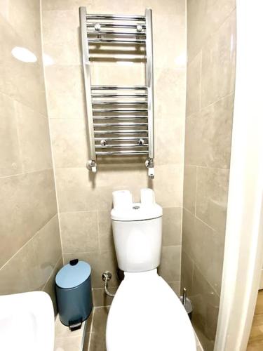 a small bathroom with a toilet and a mirror at Private Studio in Central London moments from Oxford St in London