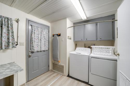 a small laundry room with a washer and dryer at Pet-Friendly Camp Verde Home Hiking, Wine and More! in Camp Verde