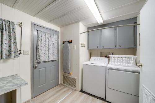 a small laundry room with a washer and dryer at Near Hiking and Wineries Charming Camp Verde Home! in Camp Verde