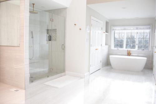 two images of a bathroom with a tub and shower at Hygge, Upscale & Relaxing Luxury in Potomac