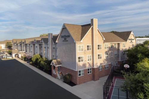 an aerial view of a large apartment building at Residence Inn Boston Dedham in Dedham