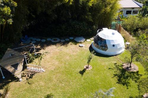 an object that looks like a ufo in a yard at Dome in the Heart of Boquete. in Boquete