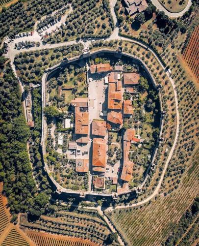 an overhead view of a large estate with buildings and roads at Monteriggioni Castello in Monteriggioni