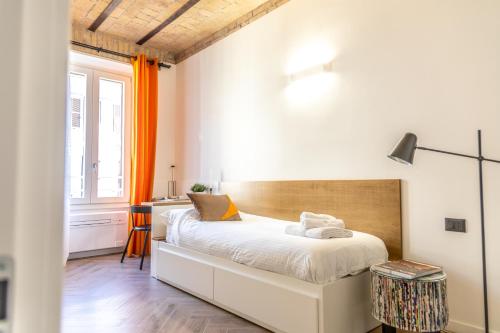 a bedroom with a bed and a window at Testaccio Boutique Apartment in Rome in Rome