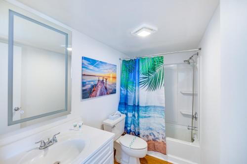 a bathroom with a sink and a toilet and a shower at Fort Myers Beach Studio with Balcony and Views! in Fort Myers Beach