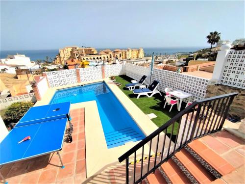 a view of the pool from the balcony of a apartment at Villa Las Mercedes - Urbanización El Castillo in Fuengirola