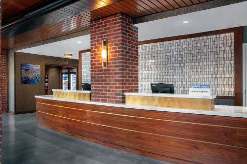 a lobby with a cash counter in a building at Residence Inn by Marriott Norwalk in Norwalk