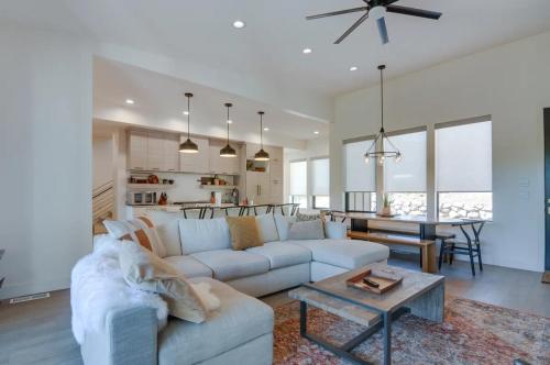 a living room with a white couch and a table at Alpine Mountain Escape in Beaver