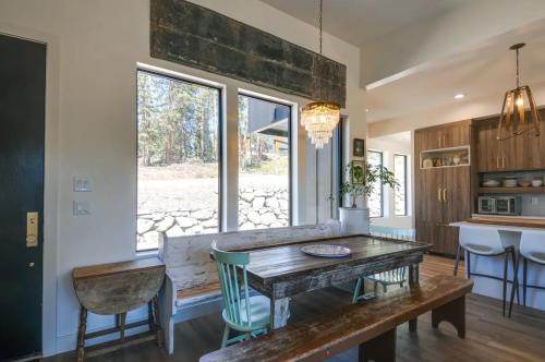a dining room with a wooden table and chairs at Alpine Mountain Escape in Beaver