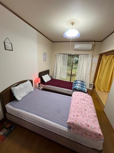 Katil atau katil-katil dalam bilik di Ocean Lovers Home