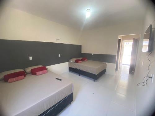 Katil atau katil-katil dalam bilik di Residencial pimenta - aluguel temporada - apto mobiliado