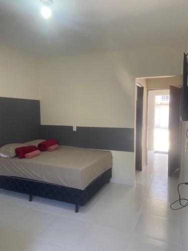 Katil atau katil-katil dalam bilik di Residencial pimenta - aluguel temporada - apto mobiliado