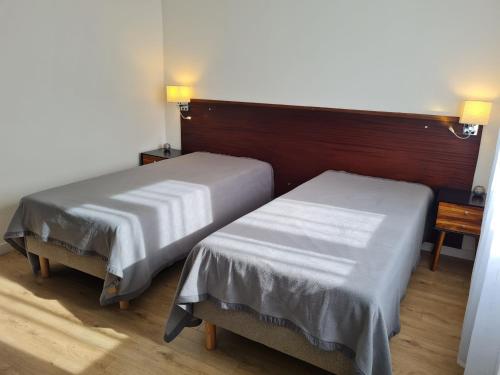 Кровать или кровати в номере Gîte Lunéville, 2 pièces, 4 personnes - FR-1-584-180