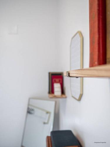 a shelf in a room with a refrigerator and a shelf at Artful Escape at Marietta Square in Marietta