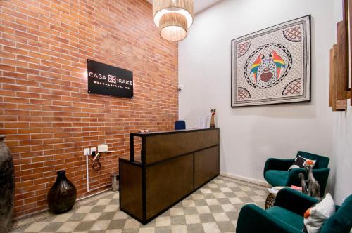 a waiting room with a podium and two chairs at Casa Irake in Guadalajara