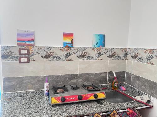 a kitchen counter with a stove and a sink at Fresh studio in Dahab in Dahab