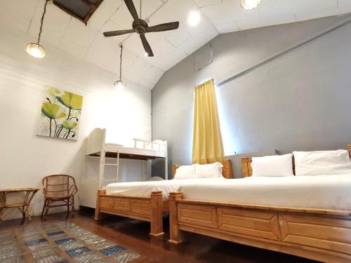 Postel nebo postele na pokoji v ubytování Mori Jonker Homestay