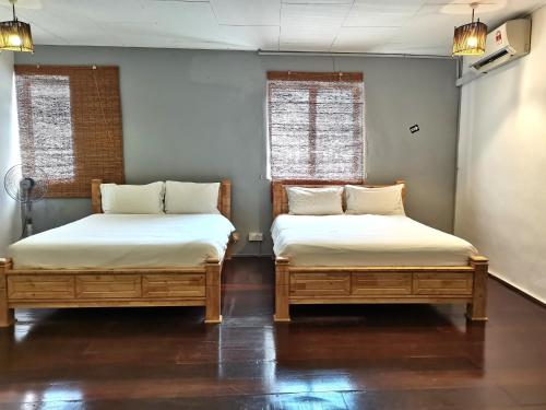 Ένα ή περισσότερα κρεβάτια σε δωμάτιο στο Mori Jonker Homestay