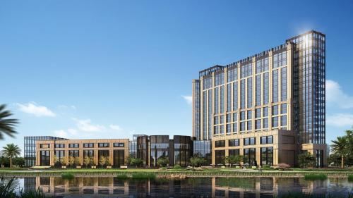 a rendering of a large office building with a pond at InterContinental Changzhou by IHG in Changzhou